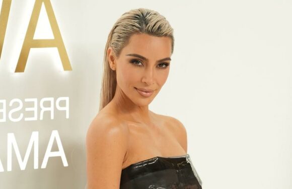 Kim Kardashian Pairs a Tiny Latex Bra Top With Thigh-High Boots