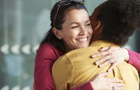 My boss keeps trying to hug me at work but I can't stand it