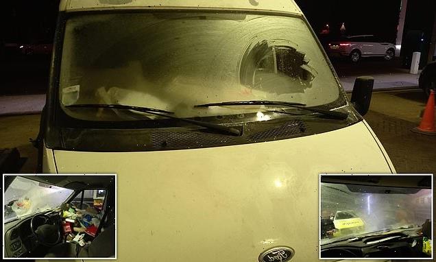 Police stop white van driver who de-iced TINY patch of windscreen