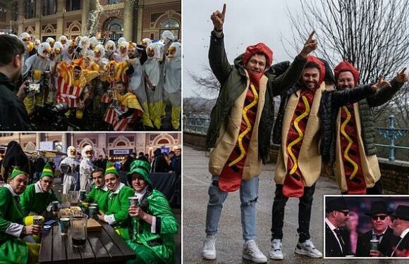 Thousands of boozy darts fans descend on Ally Pally in fancy dress