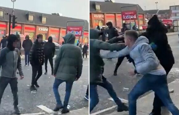 Carnage outside Wetherspoons as hooded yobs stop traffic with wild street brawl