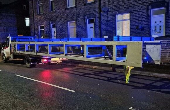 Driver is stopped with metal load that made his van longer than a BUS