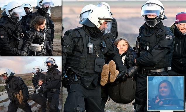 Greta Thunberg seen laughing with police while posing for pictures
