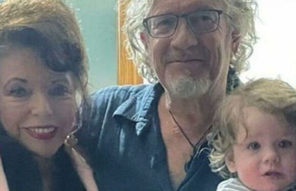 Joan Collins looks younger than ever as she welcomes new addition