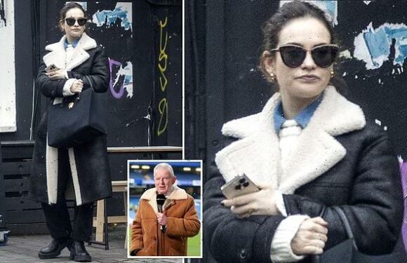 Lily James channels legendary football commentator in sheepskin coat