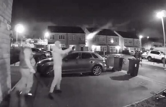 Masked thug blasts house with shotgun as accomplice uses sledgehammer
