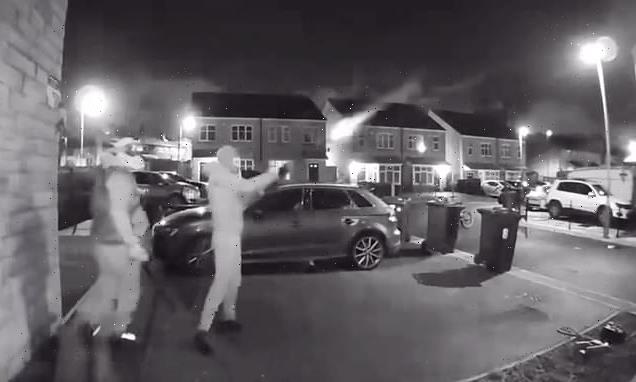 Masked thug blasts house with shotgun as accomplice uses sledgehammer