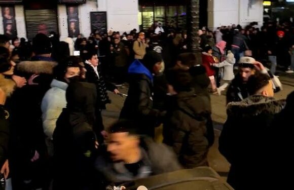 Moment people break through barriers to see New Year's fireworks