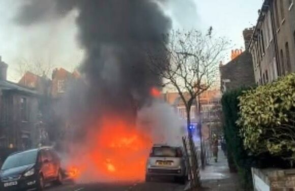 Moment school bus burst into flames with children inside on busy road