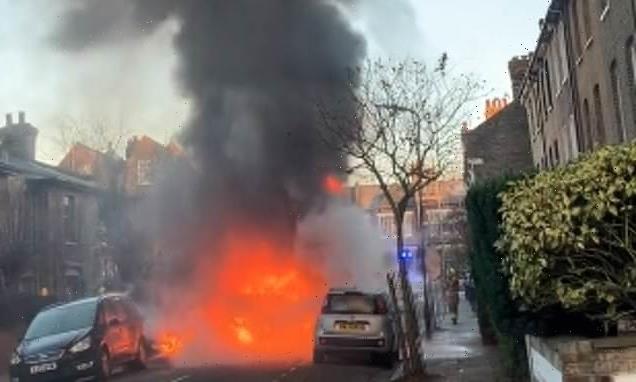 Moment school bus burst into flames with children inside on busy road