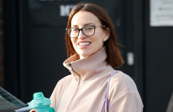 Smiling Ferne McCann reveals first glimpse of baby bump in gymwear after workout