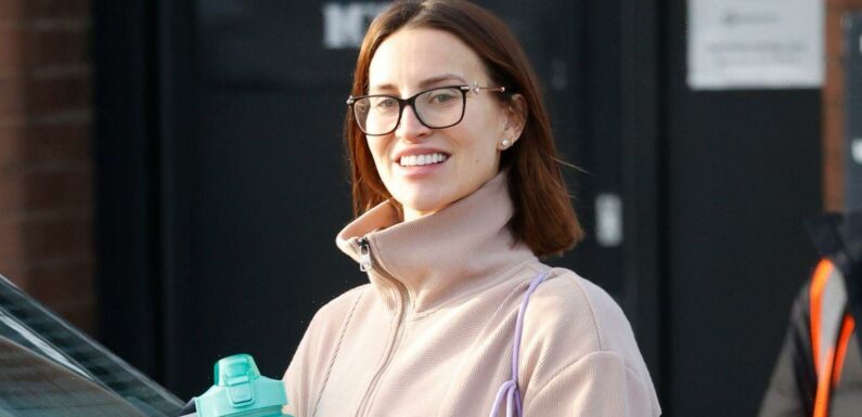 Smiling Ferne McCann reveals first glimpse of baby bump in gymwear after workout