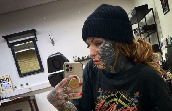 Tattooed mum wears leather boob top as she treats fans to snap showing inkings