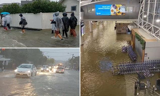 Torrential rain batters Auckland with airport flooded, homes evacuated