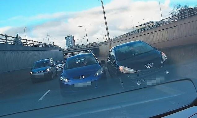 Watch as reckless driver rams into A41 central reservation