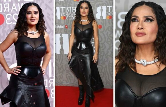 Ageless Salma Hayek dons busty leather corset and fishnets at Brits