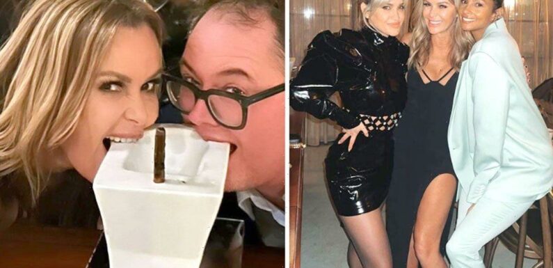 Amanda Holden wows in thigh-split birthday dress as she gets odd cake