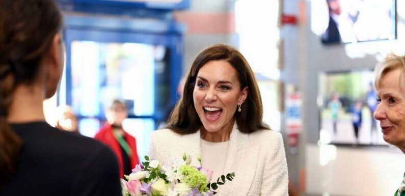 Beaming Kate Middleton is a modern Princess as she rocks trainers on school visit