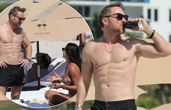 David Guetta displays his defined abs in Miami with Jessica Ledon