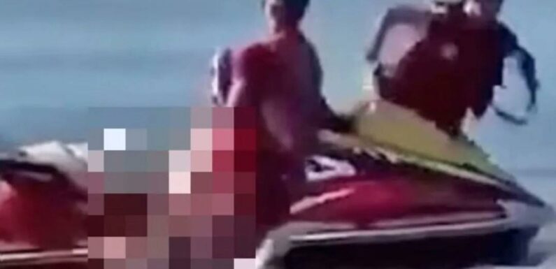 Dramatic moment hero lifeguards desperately try to save shark attack victim after racing him to beach on jet ski | The Sun