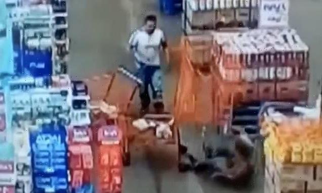 Man throws SHOPPING TROLLEY at customer, knocking her unconscious