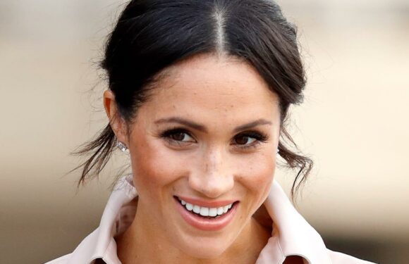 Meghan Markle cuts an elegant silhouette in £1.8k trench coat for unexpected appearance