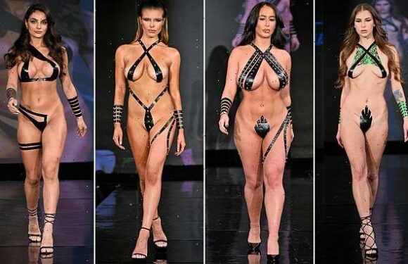 Models strut down the catwalk wearing nothing but tiny pieces of TAPE