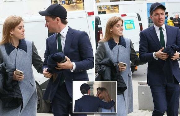 Princess Beatrice's husband wraps his arm around her outside Wembley