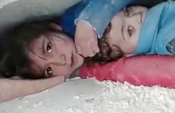 Syrian girl found protecting brother as they're rescued beneath rubble