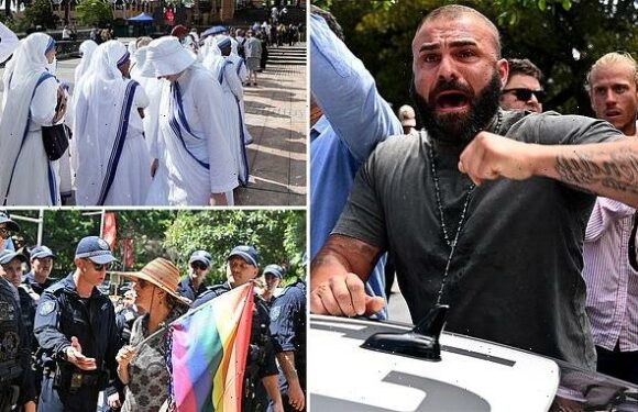 Tense scenes outside George Pell's funeral as cops break up crowd