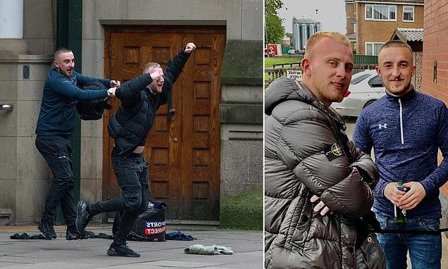 Two louts celebrate outside court as they avoid jail