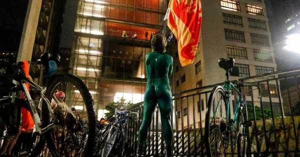 Dozens of cyclists bare all and hit the streets in naked protest over safety