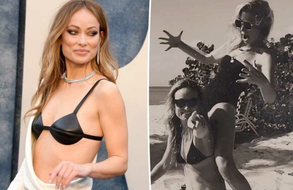 Olivia Wilde heats up the beach in a teeny black bikini