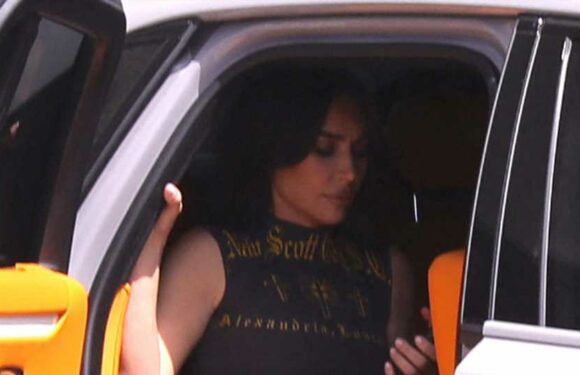 Kim Kardashian shows off her tiny waist in baggy sweats as she steps into her $600K Lamborghini for rare unedited photos | The Sun