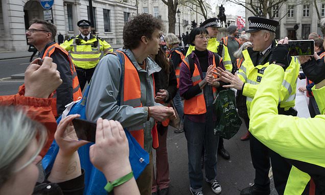 Police confront Just Stop Oil eco-mob causing travel chaos in London