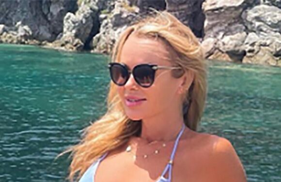 Amanda Holden gives ‘Bond girl vibes’ as she sunbathes in tiny blue bikini