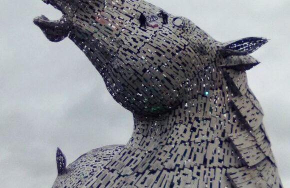 Daredevil climate protestors manage to scale 100ft steel horse monument