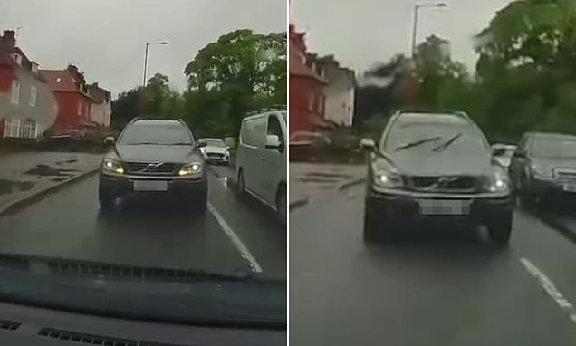 Driver overtakes traffic jam then nearly crashes into oncoming car