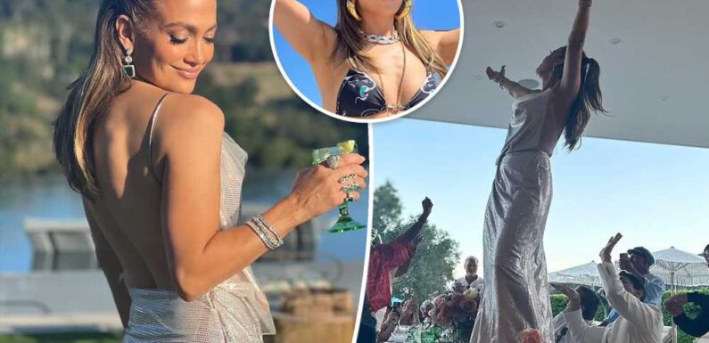 Jennifer Lopez dances on a table in backless metallic look for 54th birthday, shows off bikini bod