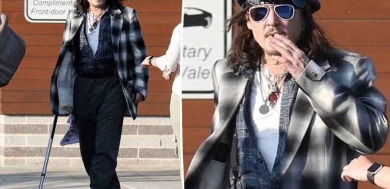 Johnny Depp, 60, seen using cane at Boston gig after injuring ankle