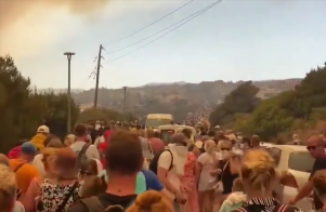 Massive wildfire on Greek holiday island Rhodes as hotels evacuated & 1,000 people rescued by boats from beaches | The Sun