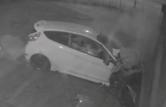 Moment five youngsters are hurt as their car skids into garage wall
