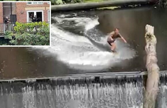 Moment thrill-seeker waterskis across weir on the River Wear in Durham
