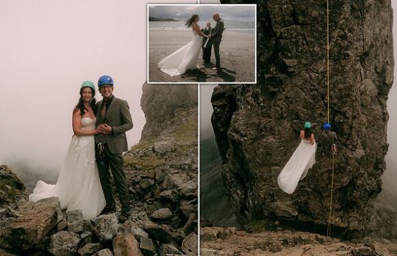 Newlyweds scale notorious 3,000ft peak in full wedding attire