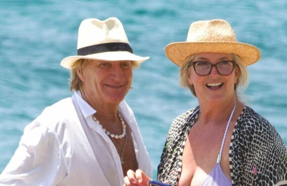 Rod Stewart looks besotted with bikini-clad wife Penny Lancaster on beach