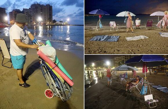 Spanish locals hog prime spots on Costa Blanca beach before dawn
