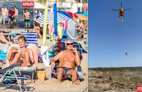 Sweltering tourists brave extreme heat to pack Benidorm beaches