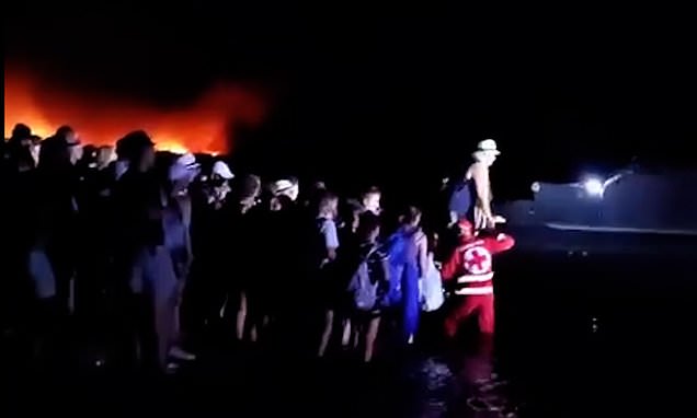 Terrified tourists loaded onto escape vessels as Rhodes wildfires rage