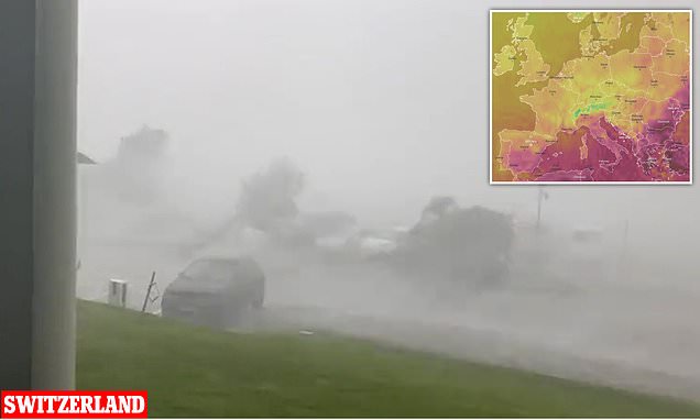 Terrifying moment daylight disappears as tornado hits Swiss town