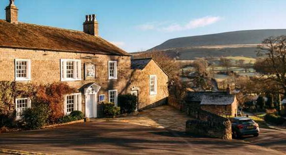UK’s picturesque fairytale village where road markings and TV aerials are banned